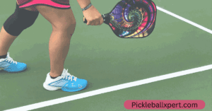 A person holding Pickleball paddle
