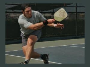A player playing pickleball.